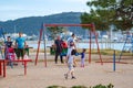 Children play in sunny summer city park on the seafront Royalty Free Stock Photo